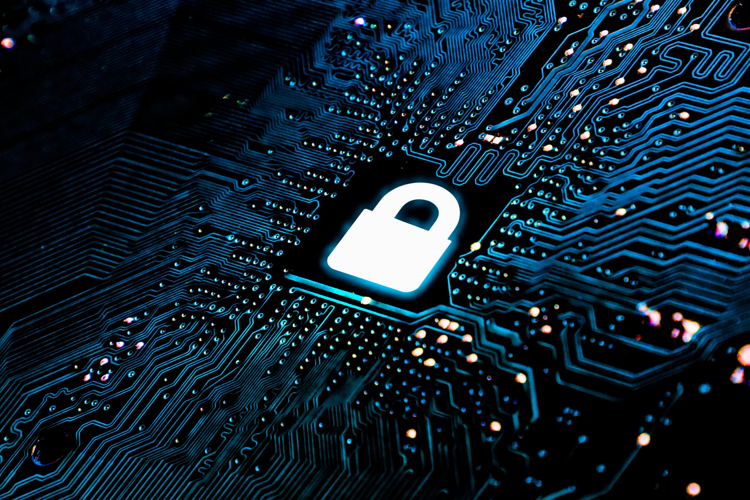 Glowing padlock icon embedded in a computer circuit board, symbolizing cybersecurity and data protection.