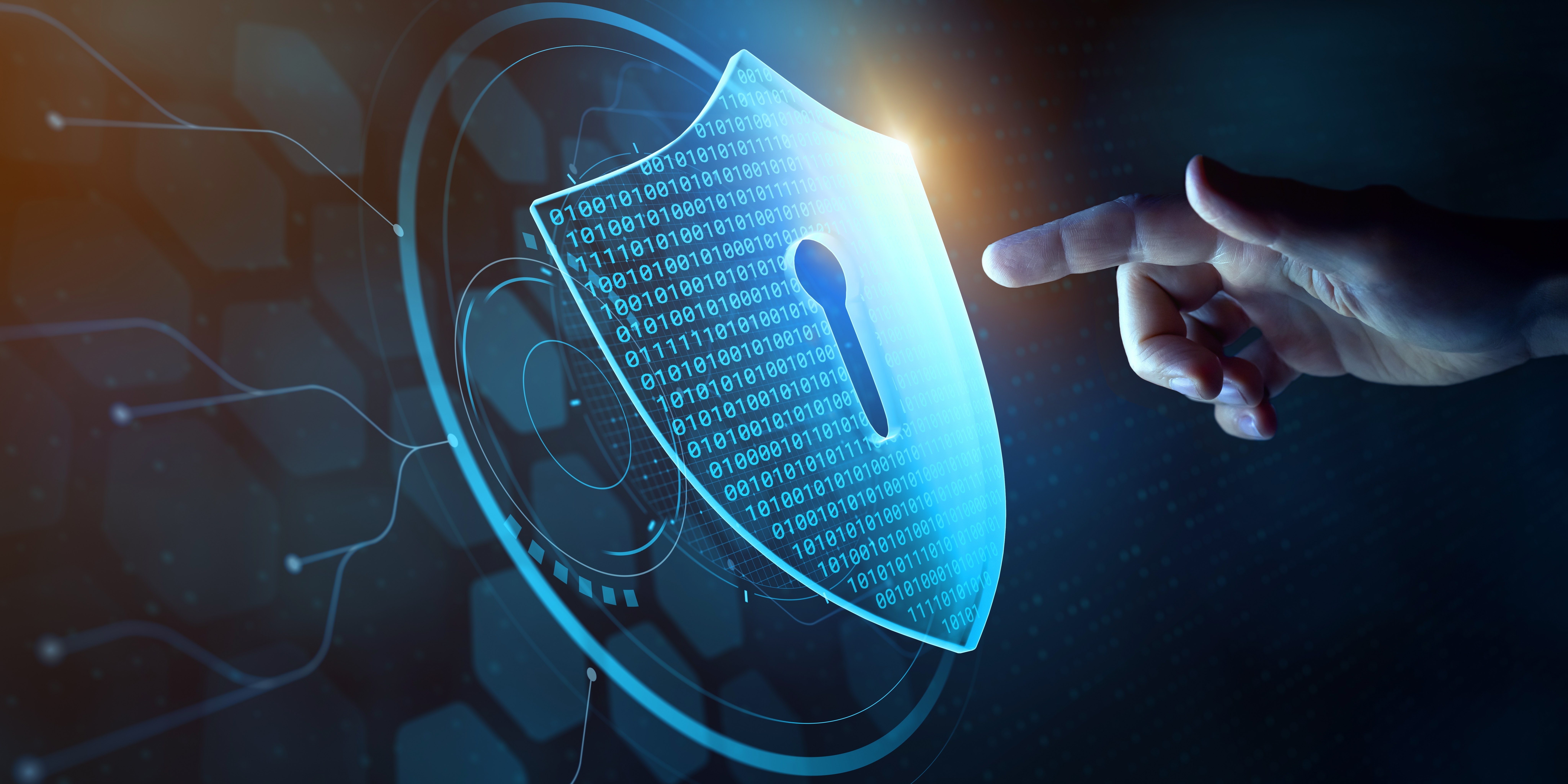 person pointing at a shield with coding and a key lock