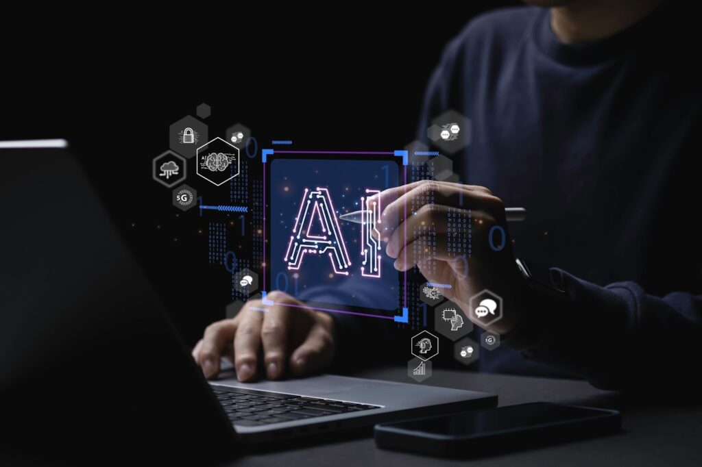 Artificial intelligence concept showing a person working on a laptop with AI interface and data icons