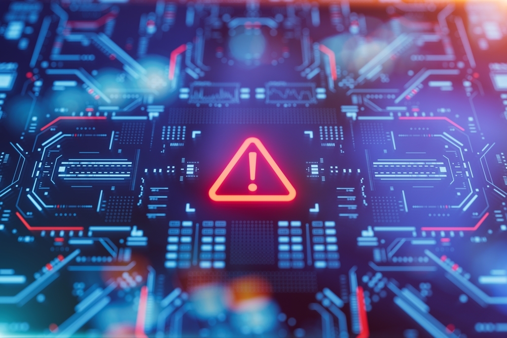 Digital cybersecurity warning symbol displayed on a computer circuit board representing a security threat or system vulnerability.